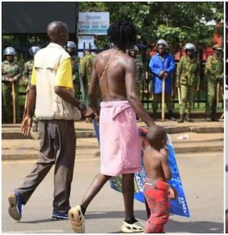 Umugabo yagaragaye mu myigaragambyo arikumwe n'umwana we w'imyaka itatu